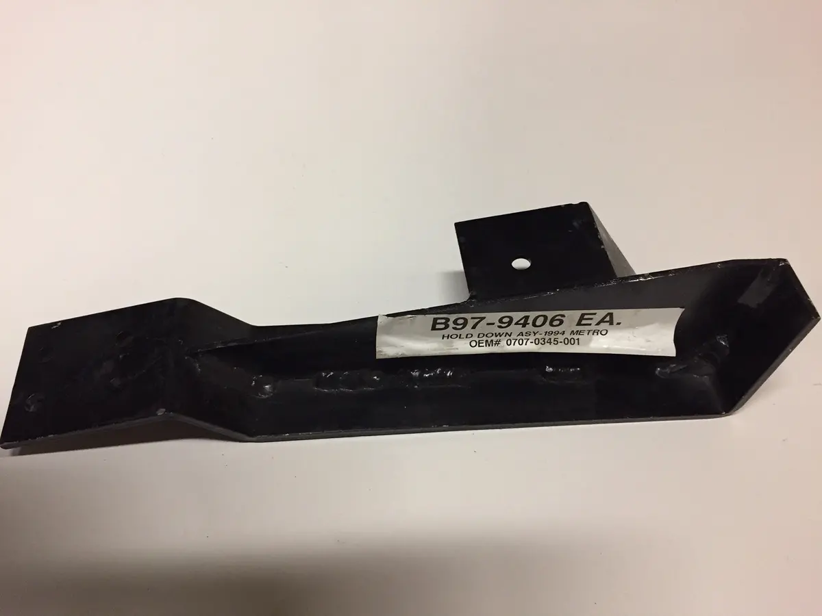 1994 Metro Oem # 0707-0345-001 Hold Down Assembly 1